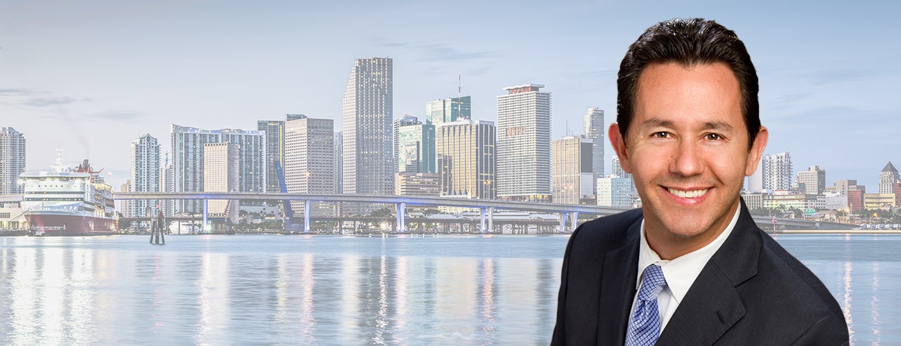 Hero Banner - Picture of Patrick Vilar over a skyline of Miami.