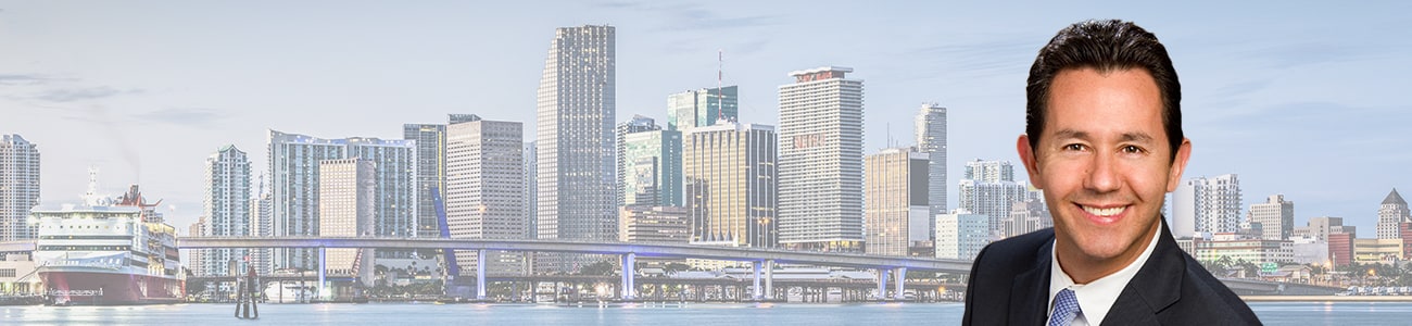 Hero Banner - Picture of Patrick Vilar over a skyline of Miami.